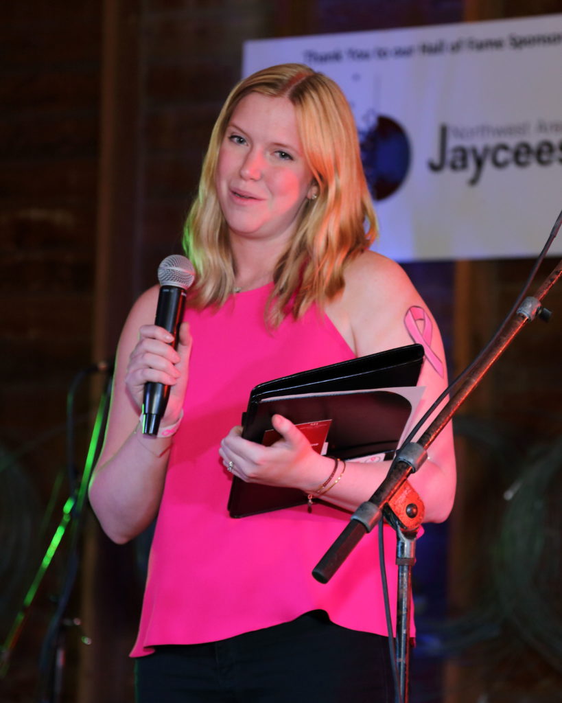 Survivor speaker with her notebook