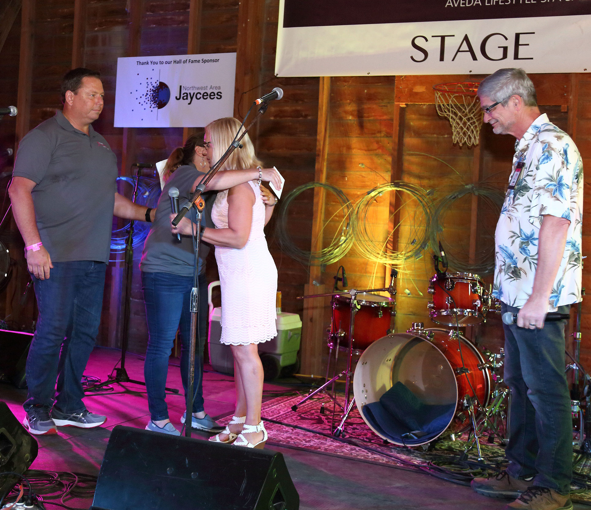 Judy and Jim presenting Todd and Debbie the Volunteers of the year award in 2018